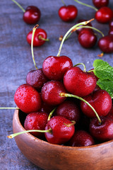 Cherry bowl with sweet cherries with leaf