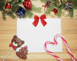 christmas candy greeting card and decoration on wooden background