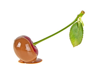 Cherry in hot milk chocolate on a white background