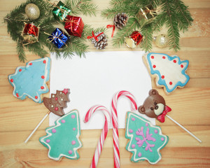 christmas cookies greeting card and decoration on wooden background
