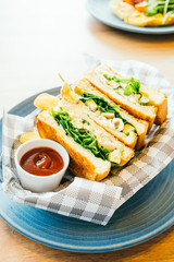 Sandwich with avocado and chicken meat with french fries