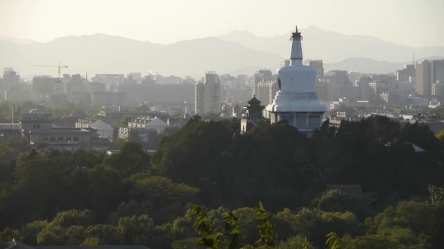 panoramic view of BeiJing BeiHai Park White Tower & metropolis high rise buildings urban.
