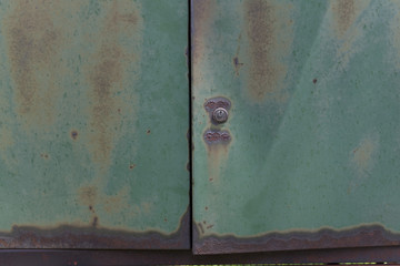 rusty metallic green door