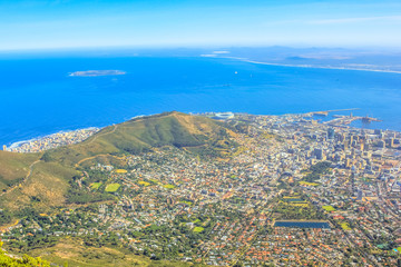 Fototapeta na wymiar The Cape Town City Bowl as seen from Table Mountain National Park in South Africa, Western Cape. Aerial view of the Cape Town Harbour and Signal Hill.