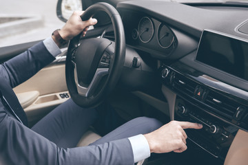 Naklejka premium Young business man test drive new car