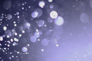 A beautiful and blurry bokeh on a purple background.