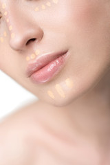 Stunner young woman using concealer