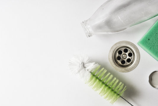 A bottle of milk in the sink while washing