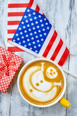 Obraz premium Coffee, USA flag and present. Cup of latte. Christmas in America.