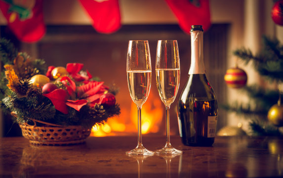 Closeup image of two glasses of champagne on Christmas table