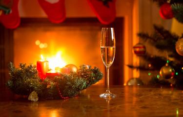 Glass with champagne on Christmas table