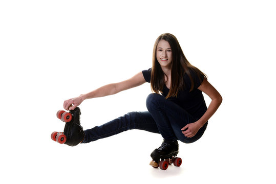 teen girl doing shoot the duck roller skate move