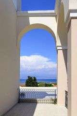 Arch terrace on summer in luxury resort with beautiful Mediterranean sea view. Corfu island in Greece.
