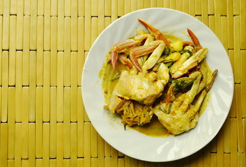 stir fried flower crab in yellow curry on plate