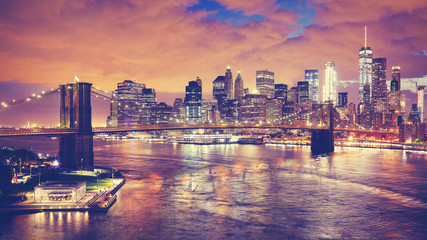 Color toned panoramic picture of New York City at night, USA..