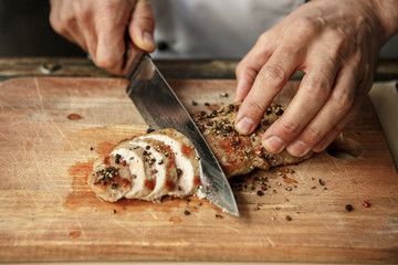  Mature man professional chef cooking meal indoors