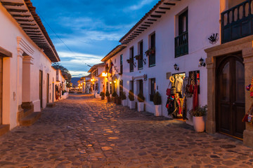 Evening moody view of a cobbled street in colonial town Villa de Leyva, Colombia.