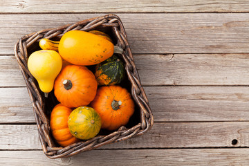 Autumn pumpkins on wooden table