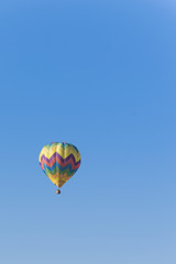 Fototapeta na wymiar Isolated Hot Air Balloon in a blue sky