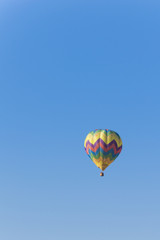 Isolated Hot Air Balloon in a blue sky