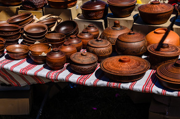 Different wooden pots for sale on a fair