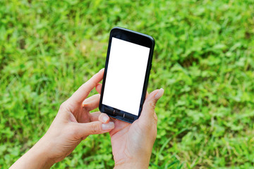 Mobile phone in women hand and blurred background