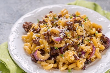 tasty cellentani pasta with meat sauce