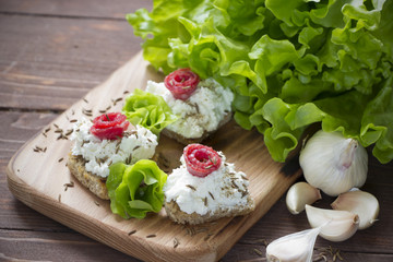 Cream cheese sandwiches with salami and salad leaves,healthy food.