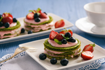 Homemade spinach cake with strawberry mousse