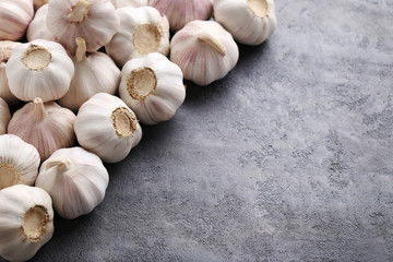 Garlic on the grey wooden table