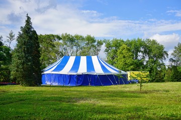 Big white blue  tent theatrical in the park