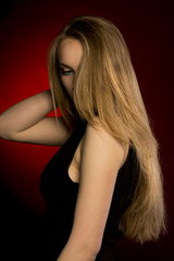 Naklejka premium Stylish model with natural makeup and lush blonde hair