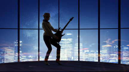 Obraz na płótnie Canvas Rock girl with guitar. Mixed media