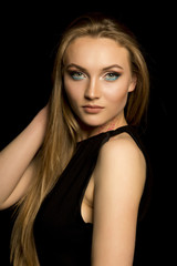 Fototapeta premium Fabulous young woman with natural makeup and lush blonde hair