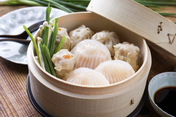 Traditional Chinese Dim Sum as close-up on Bamboo Steamer