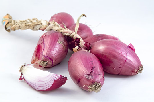 Pink italian onion braid on white background
