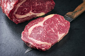 Raw dry aged Kobe Entrecote Steak as close-up on a slate