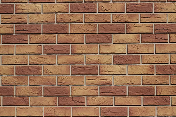 The wall is covered with artificial bricks, modern finishing materials