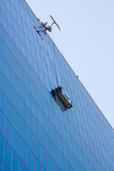 Washing Windows on the outside, industrially, in a high-rise modern building