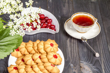 Tea fresh biscuits with cherries
