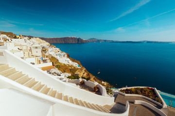 An inspirational shot featuring stone stairs, Cycladic architecture and the Aegean Sea in the Greek island of Santorini