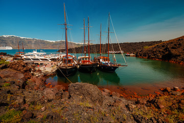A panoramic wide shot showing the volcanic desert island of Thirassia near the popular Greek island...