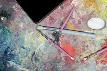 Tablet on top of an artist palette