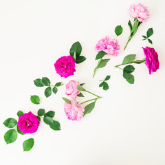 Floral composition of pink roses, peonies and leaves on white background. Flat lay, top view.