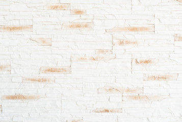 textured surface of white and beige brick wall background