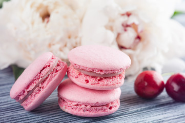 Closeup of pink macaroons on blue background