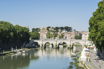 Obraz premium Bridge Sant Angelo and river Tiber in June, Rome, Italy. View from bridge of Umberto the first