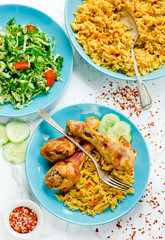 Indian roasted chicken with spicy basmati rice and fresh vegetable salad