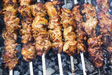 Juicy slices of meat with sauce prepare on fire