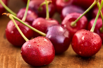 Close up of fresh cherry berries with water drops.